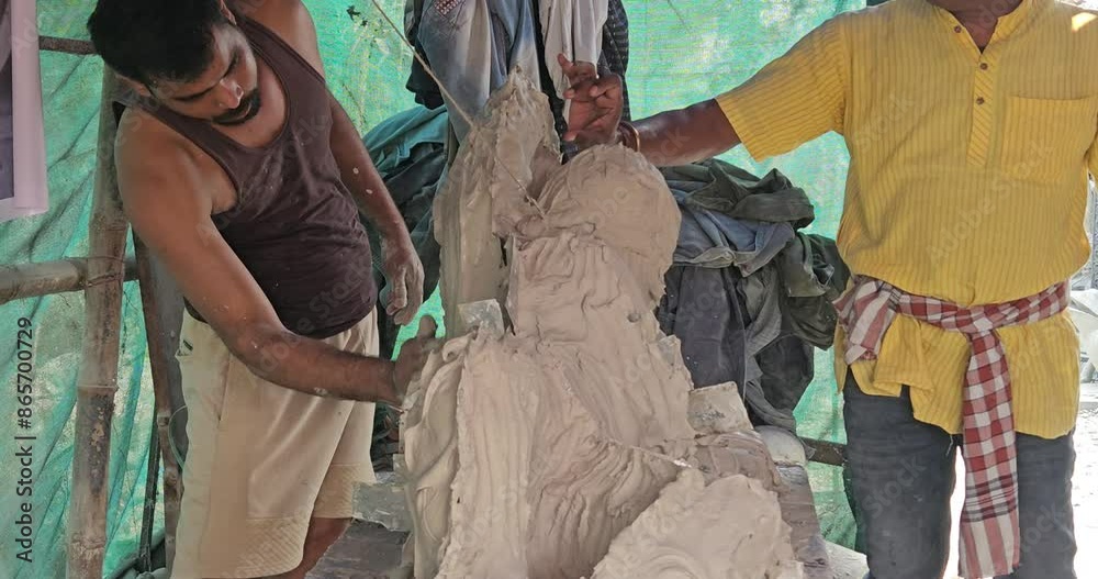 Behind the Scenes: Indian artist Casting Mold of Laomedon clay sculpture with Plaster of Paris. Behind the Scenes: Indian artist Casting Mold of Laomedon clay sculpture with Plaster of Paris.