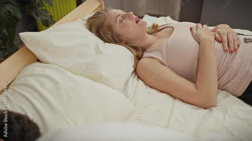 A woman and a man share a quiet moment together in a cozy bedroom setting, exuding intimacy and tranquility. A woman and a man share a quiet moment together in a cozy bedroom setting, exuding intimacy and tranquility.