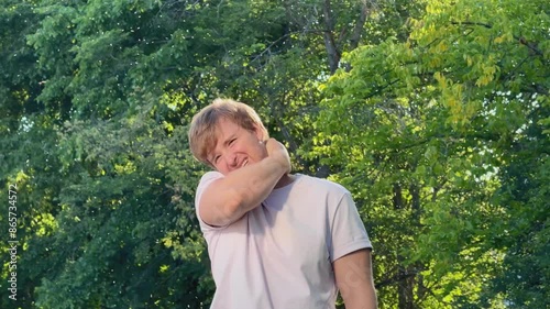 Young man suffering from mosquito bites in the forest