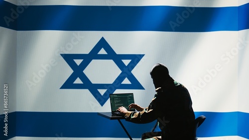 Israel intelligence agency operator uses program deploying bots on social networks, smearing political opponents. Israeli Mossad agent engages in cognitive warfare using troll accounts, camera B photo