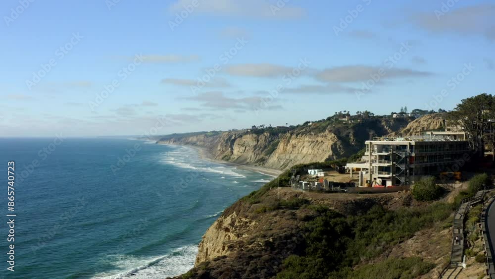 Aerial view of  La Jolla Shoreline cliffs with the Pacific Ocean in San Diego California on a clear day with blue sky