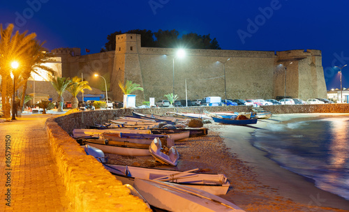 Evening view of the high walls of the Kasbah (fortress) from Hammamet harbor, Tunisia, North Africa