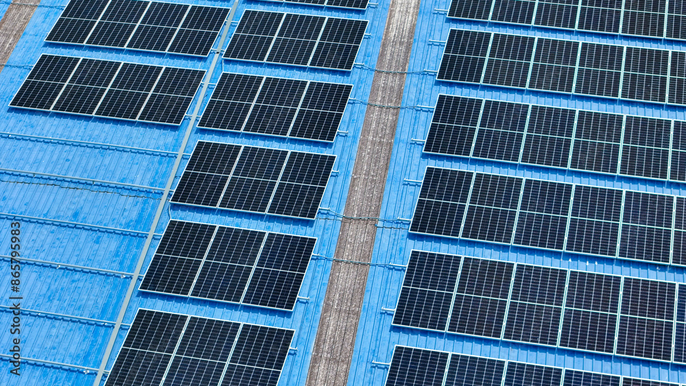top view of grid of technology renewable solar energy. construction solar panels system on roof. Installing solar photovoltaic panel system. background of blue of solar cell system and structure roof. top view of grid of technology renewable solar energy. construction solar panels system on roof. Installing solar photovoltaic panel system. background of blue of solar cell system and structure roof.