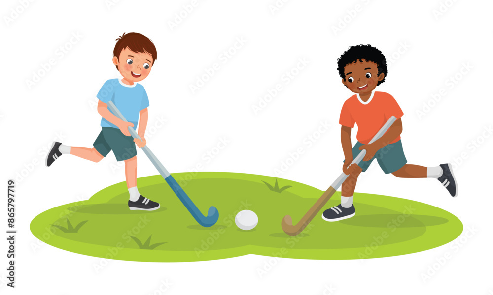 Fototapeta premium Cute little boys kids playing field hockey