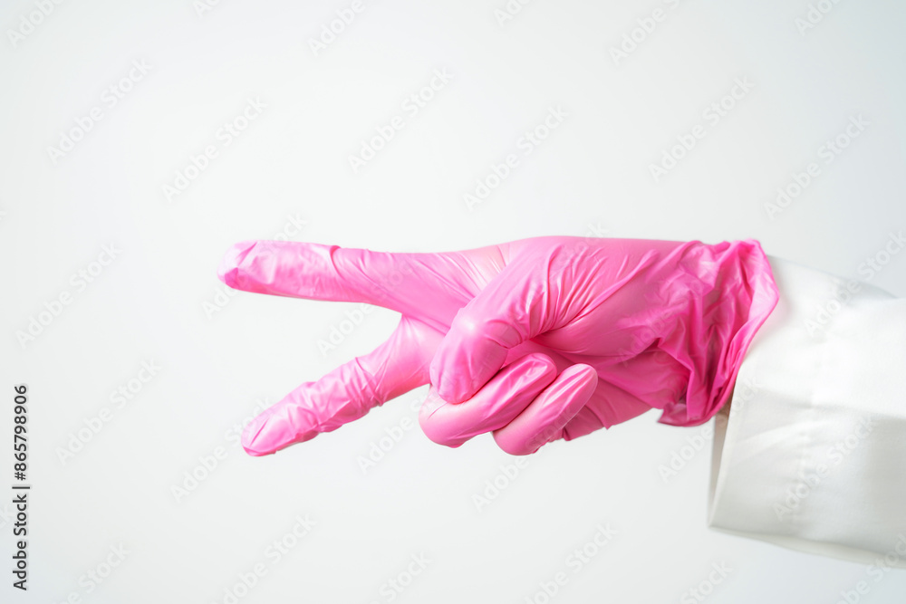 hand gestures or signs in pink disposable latex surgical gloves isolated hand gestures or signs in pink disposable latex surgical gloves isolated