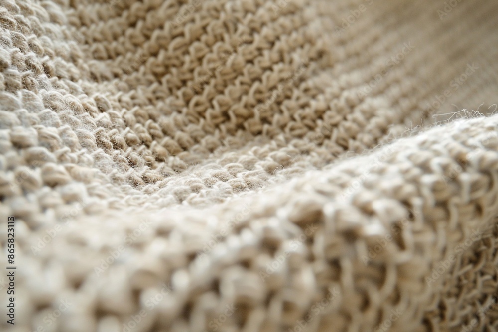 Close-up of textured beige fabric with tactile detail Close-up of textured beige fabric with tactile detail