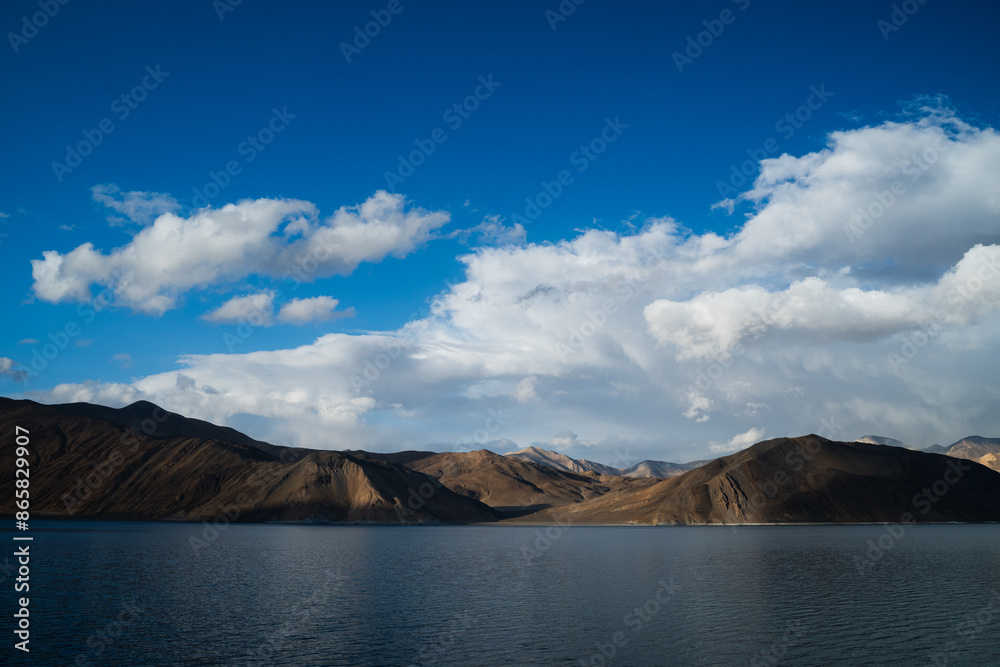 The blue waters of Pangong Lake are surrounded by the Himalayas. It is a large lake in Ladakh where China and India coexist according to India China. The blue waters of Pangong Lake are surrounded by the Himalayas. It is a large lake in Ladakh where China and India coexist according to India China.