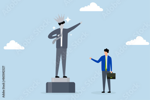 Ego, self important, businessman looks at statue of his self success and thinks about his ego.