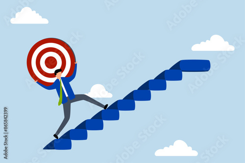 Effort and ambition to reach goal, strong businessman carrying big target on his shoulder going up the stairs.