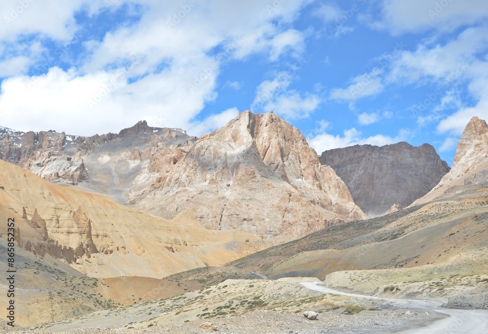 Leh Mountain Peaks Shrouded in Clouds under Clear Blue Sky Leh Mountain Peaks Shrouded in Clouds under Clear Blue Sky