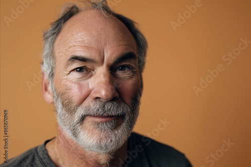 Portrait of a senior man with a grey beard and mustache.