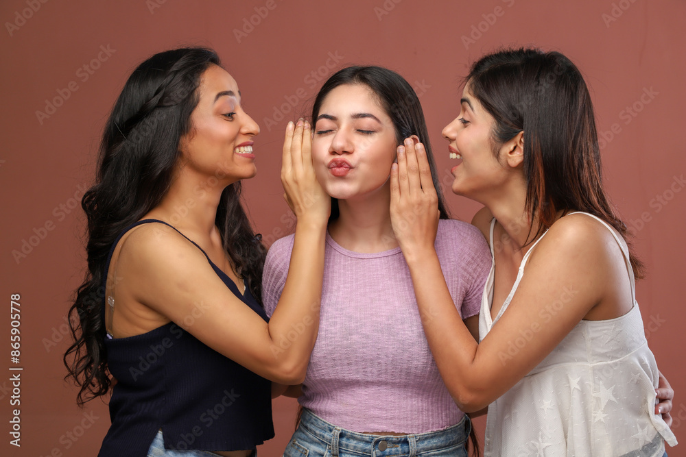 Three Charming Girls Are Whispering In Each Other's Ears And Making Pout Three Charming Girls Are Whispering In Each Other's Ears And Making Pout