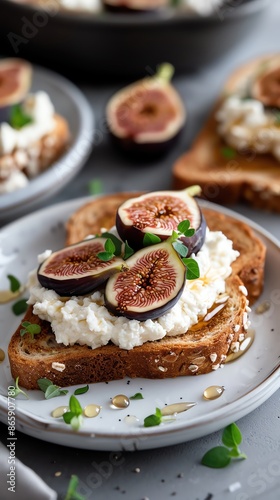 Delicious whole grain toast topped with fresh figs, ricotta cheese, and honey, beautifully presented on a rustic plate.