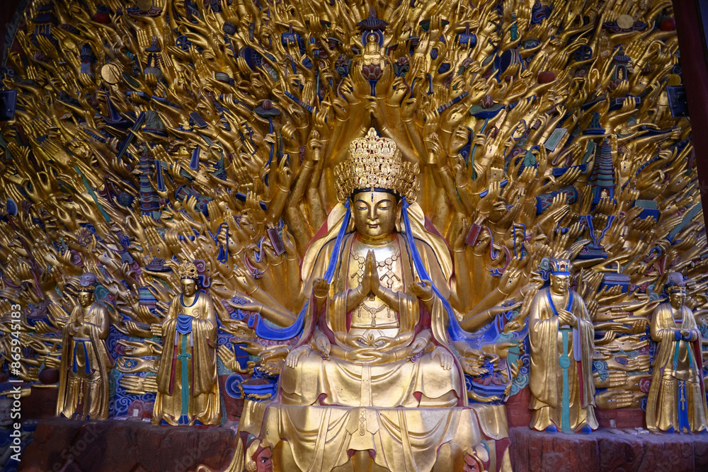 Golden sculpture of Guanyin with thousand hands at Dazu Rock Carvings at Mount Baoding or Baodingshan in Chongqing, China. UNESCO World Heritage. Golden sculpture of Guanyin with thousand hands at Dazu Rock Carvings at Mount Baoding or Baodingshan in Chongqing, China. UNESCO World Heritage.