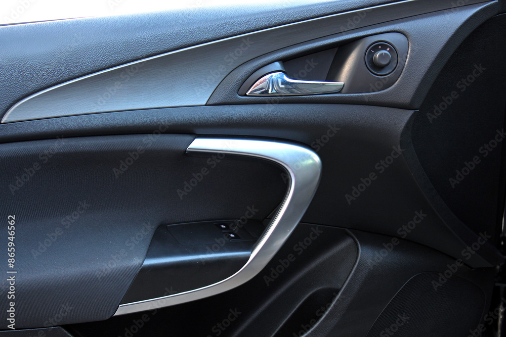 Drivers door trim. Door handle with windows controls. Car Door handle with rear view mirror adjustment. Drivers door trim. Door handle with windows controls. Car Door handle with rear view mirror adjustment.