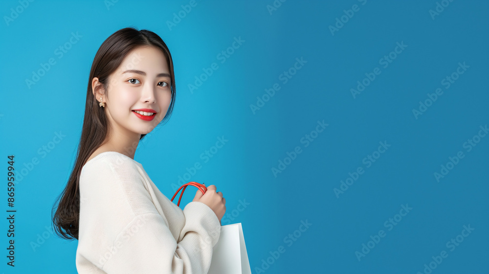 Asian woman with a good figure shopping. She appears to be having fun. Clear background Asian woman with a good figure shopping. She appears to be having fun. Clear background