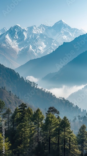 Mountain range with snow peaks and clouds