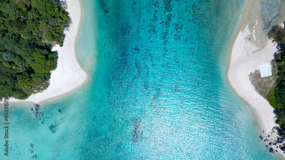The aerial view of white sand beach tropical with seashore as the ...