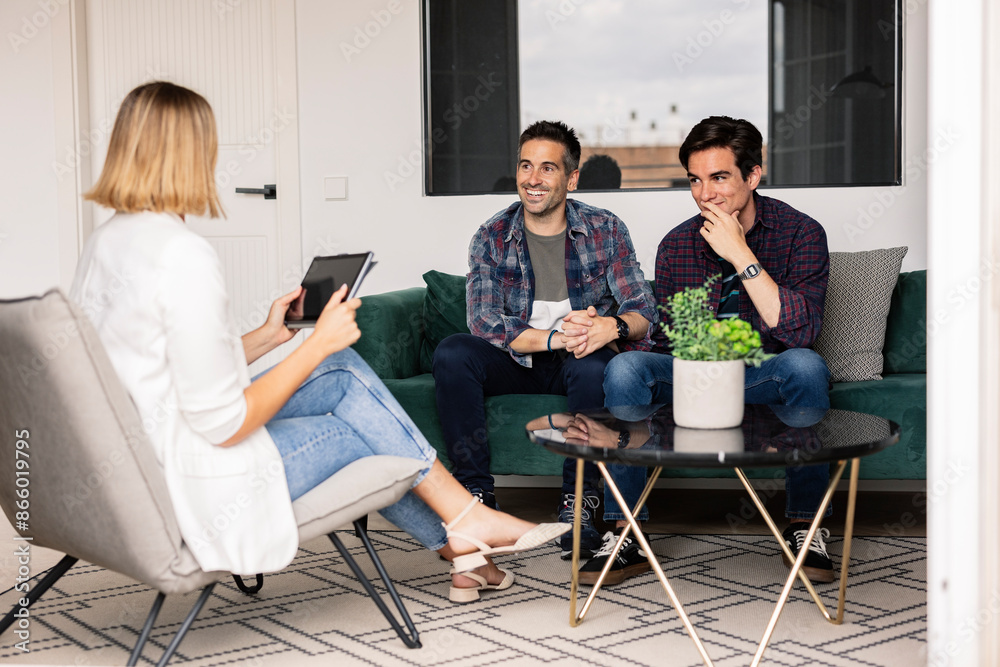 © PintoArt - Gay Couple Visiting Real Estate Agent for House Purchase © PintoArt - Gay Couple Visiting Real Estate Agent for House Purchase