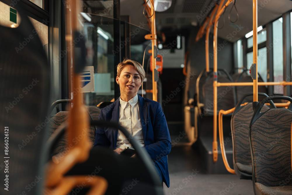 Cute short-haired woman sitting on an empty bus