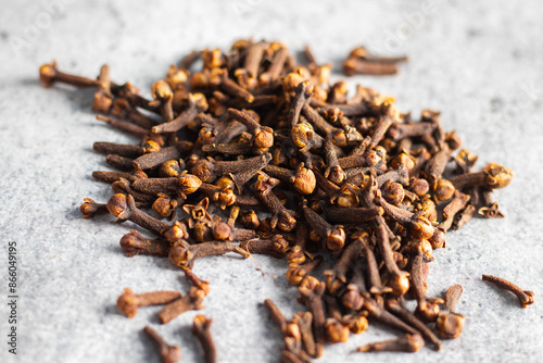 selective focus of Laung Clove, Indian spice with ceramic background.  photo