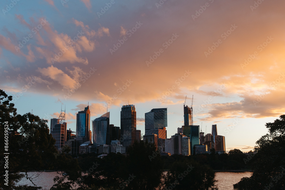 Silhouette shot of tall buildings during sunrise Silhouette shot of tall buildings during sunrise
