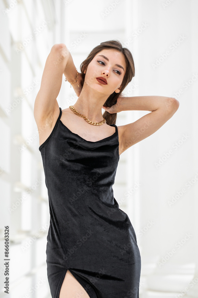 Portrait of a young girl in a long black evening dress Portrait of a young girl in a long black evening dress