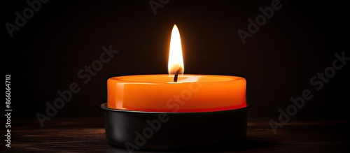 An orange candle flame flic...