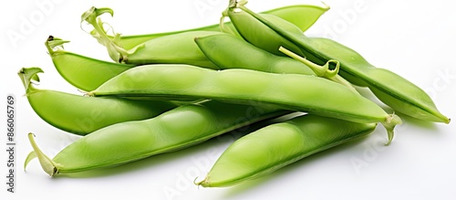 Sugar snap peas on a white ...
