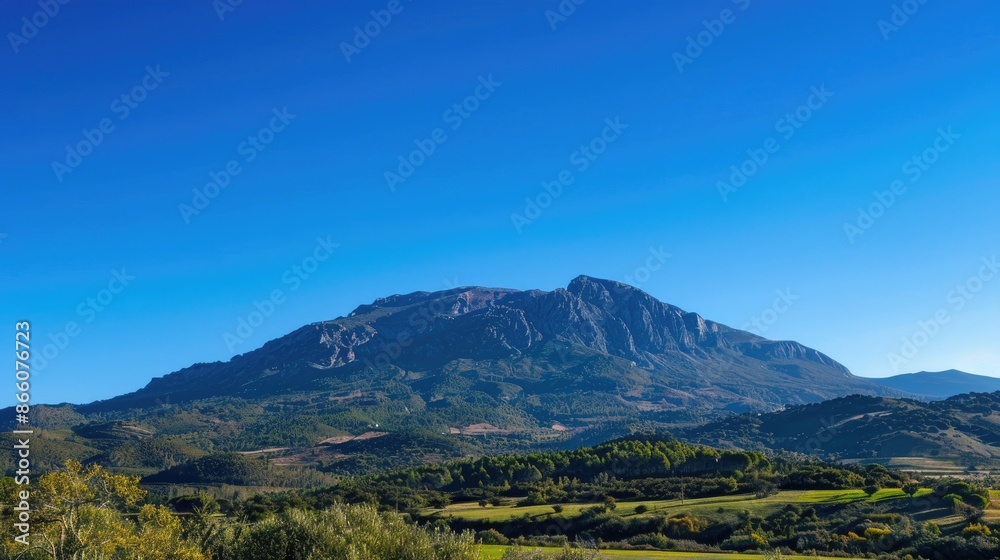 Fototapeta premium Majestic mountain in beautiful countryside under clear blue sky on sunny day