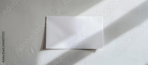 A sheet of white paper against a white backdrop, providing ample copy space image.