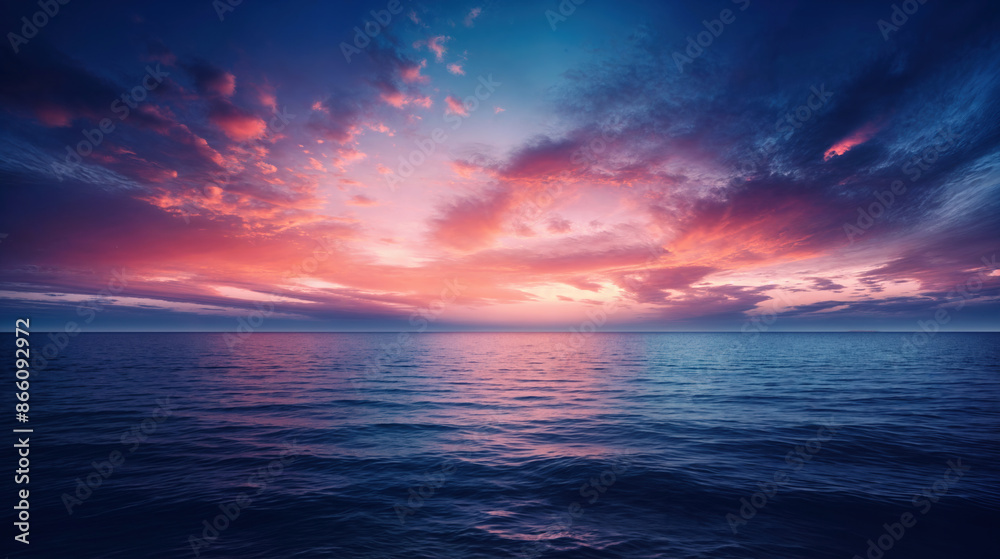 Fototapeta premium Ocean Sunset with Dramatic Clouds and Vibrant Colors Reflecting on Calm Water
