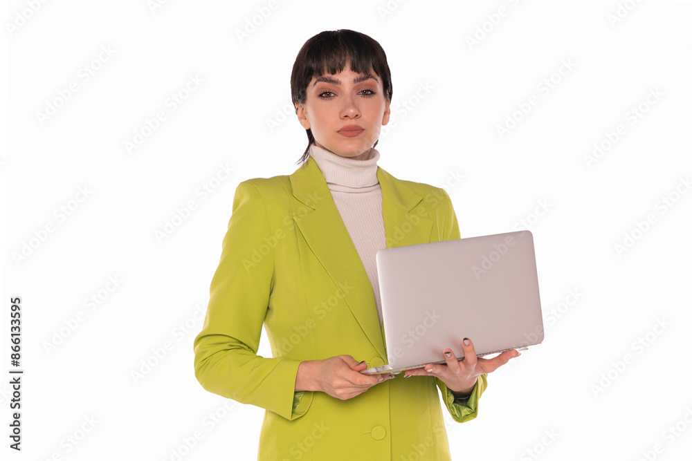 Woman in Green Blazer Holding Laptop Against White Background Woman in Green Blazer Holding Laptop Against White Background