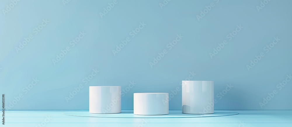 Cylindrical podiums with copy space image for showcasing products or cosmetics on a blue backdrop. Cylindrical podiums with copy space image for showcasing products or cosmetics on a blue backdrop.