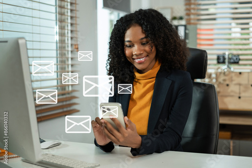 Email notification concept, Female use smartphone and laptop receive message alert in the mailbox. © NINENII