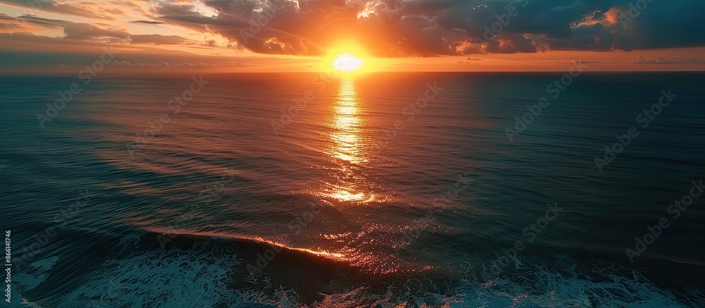 Obraz premium Sunset aerial view of the ocean, perfect for a copy space image.
