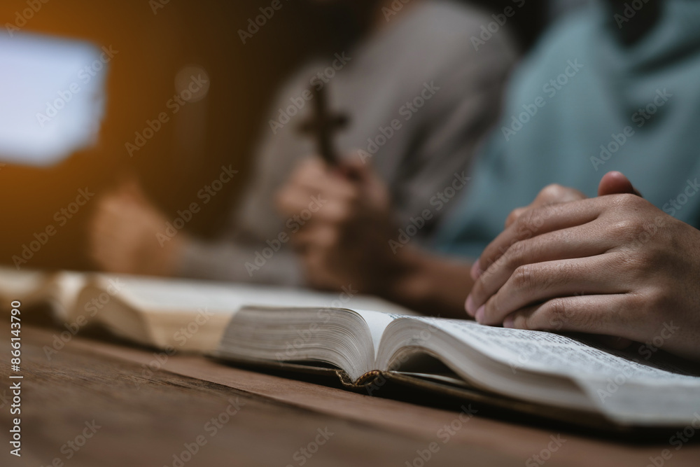 Asian men and women hands praying to god with the bible. Pray for god blessing. Religious beliefs Christian life crisis prayer to god. Asian men and women hands praying to god with the bible. Pray for god blessing. Religious beliefs Christian life crisis prayer to god.