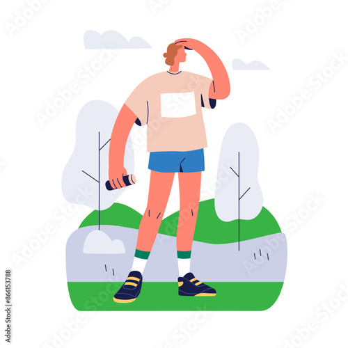 Jogger standing in park, holding water bottle. Athlete exercising outdoors wi...