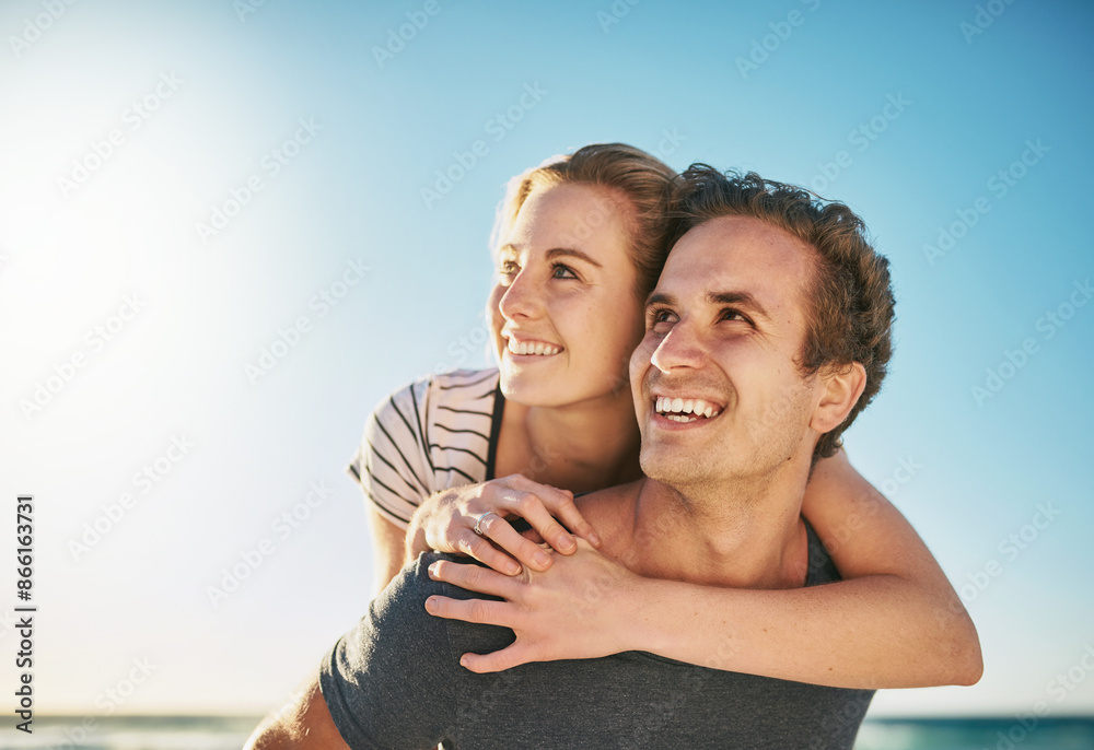 Obraz premium Couple, beach and piggyback for holiday, vacation and thinking of romance, fun and adventure together. Excited young man and woman in USA with ideas for tourism, travel and love outdoor by ocean
