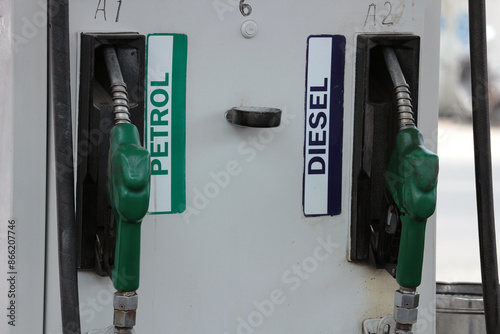 Fuel dispensing taps at a diesel and petroleum filling station. photo