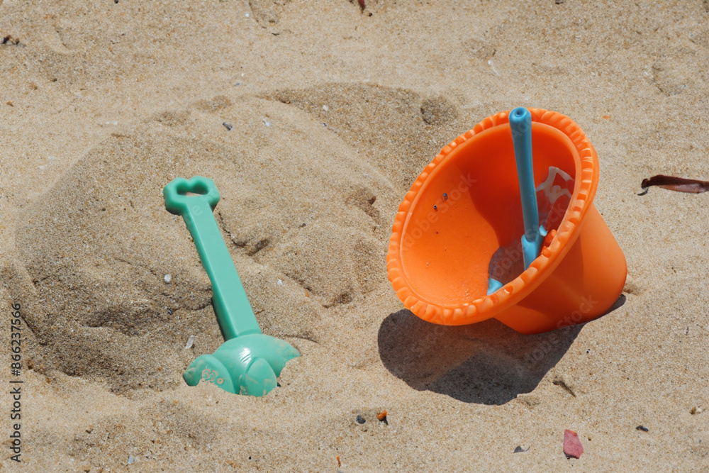 A sandbox with toys for children. Playground toy beach concept. A sandbox filled with toys of different colors. A sandbox with toys colored in the lifestyle sand for children. A sandbox with toys for children. Playground toy beach concept. A sandbox filled with toys of different colors. A sandbox with toys colored in the lifestyle sand for children.