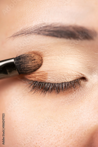 Make-up artist eyeshadow applying, makeup for eyes closeup. beauty concept