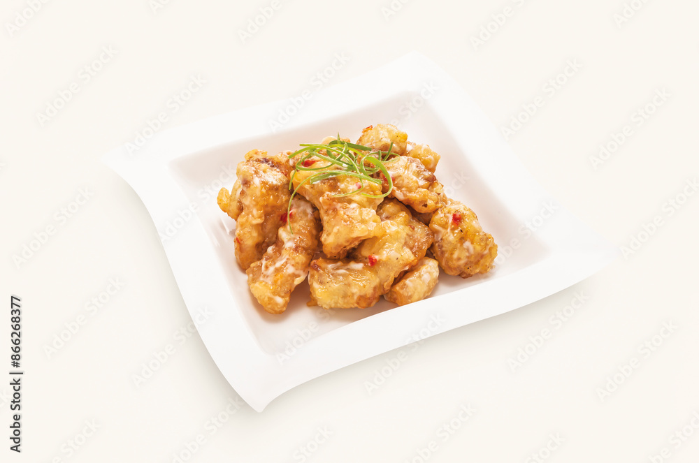 Deep Fried Hot Garlic Spareribs served in plate isolated on grey background side view of hong kong food Deep Fried Hot Garlic Spareribs served in plate isolated on grey background side view of hong kong food
