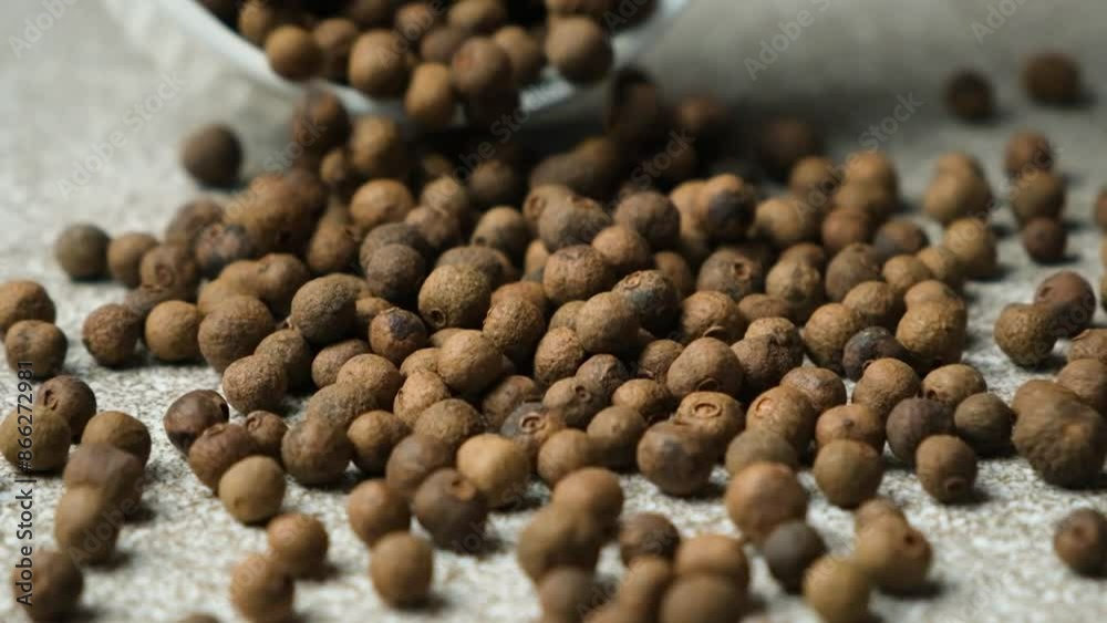 Black peppercorns in motion, slow motion Black peppercorns in motion, slow motion