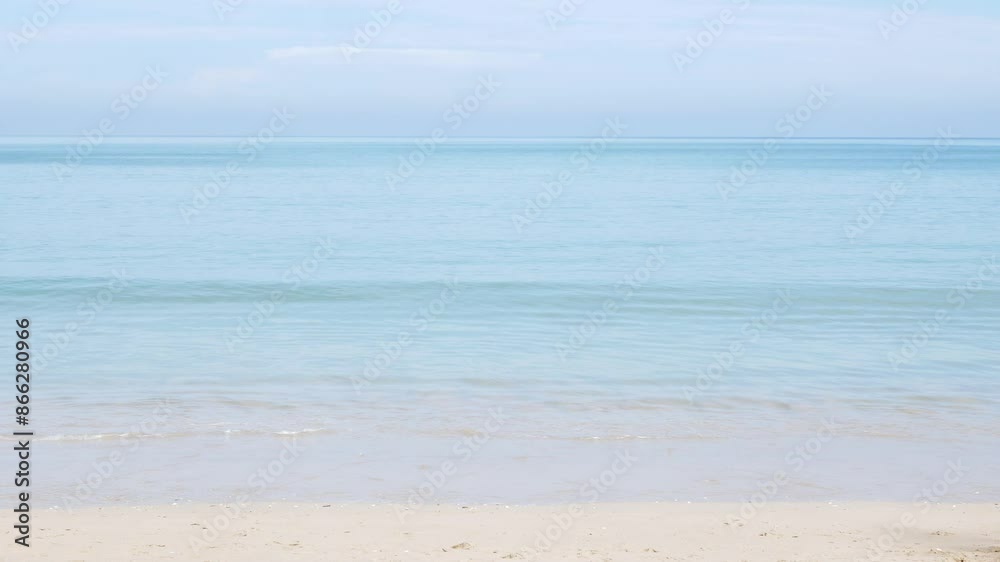 natural landscape sea beach clear water surface with some clouds in blue sky while waves is crashing on the golden white sand beach natural landscape sea beach clear water surface with some clouds in blue sky while waves is crashing on the golden white sand beach