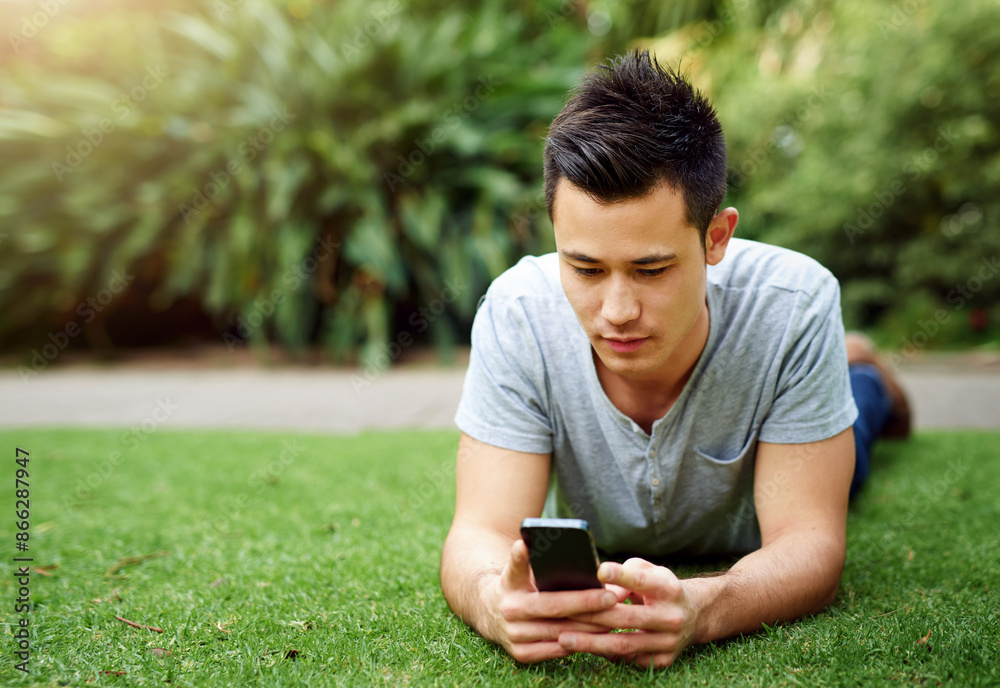 Relax, internet and man on lawn with phone for social media, chat app and chill in nature. Guy, rest and mobile in botanical garden for plant research, ecology blog and website faq for climate change Relax, internet and man on lawn with phone for social media, chat app and chill in nature. Guy, rest and mobile in botanical garden for plant research, ecology blog and website faq for climate change