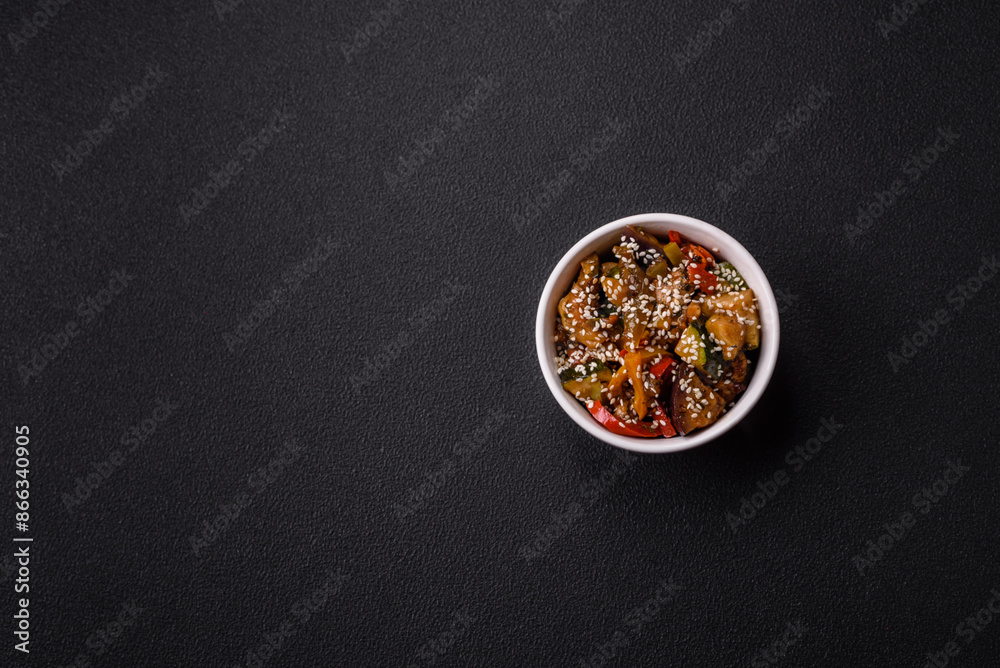 Spicy Asian dish with sliced meat fillet, hot pepper, carrots and sesame seeds Spicy Asian dish with sliced meat fillet, hot pepper, carrots and sesame seeds