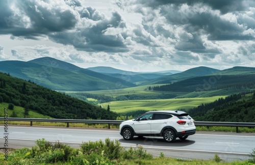 White SUV Driving Through Mountainous Landscape