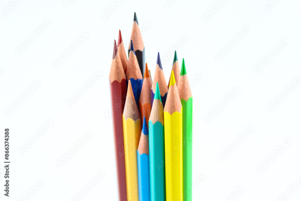 a bunch of colored pencils isolated on white background close up a bunch of colored pencils isolated on white background close up