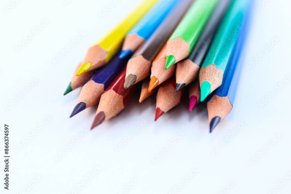 a bunch of colored pencils isolated on white background close up a bunch of colored pencils isolated on white background close up
